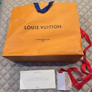 Louis Vuitton large shopping bag, clean card with ribbon, thank you note.